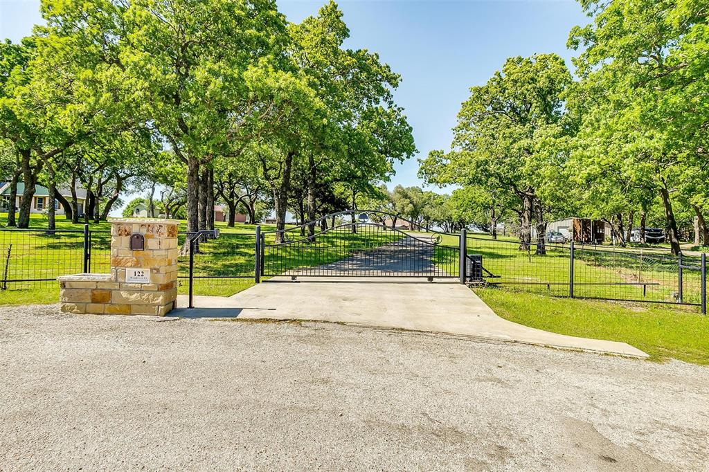 a view of a park with large trees