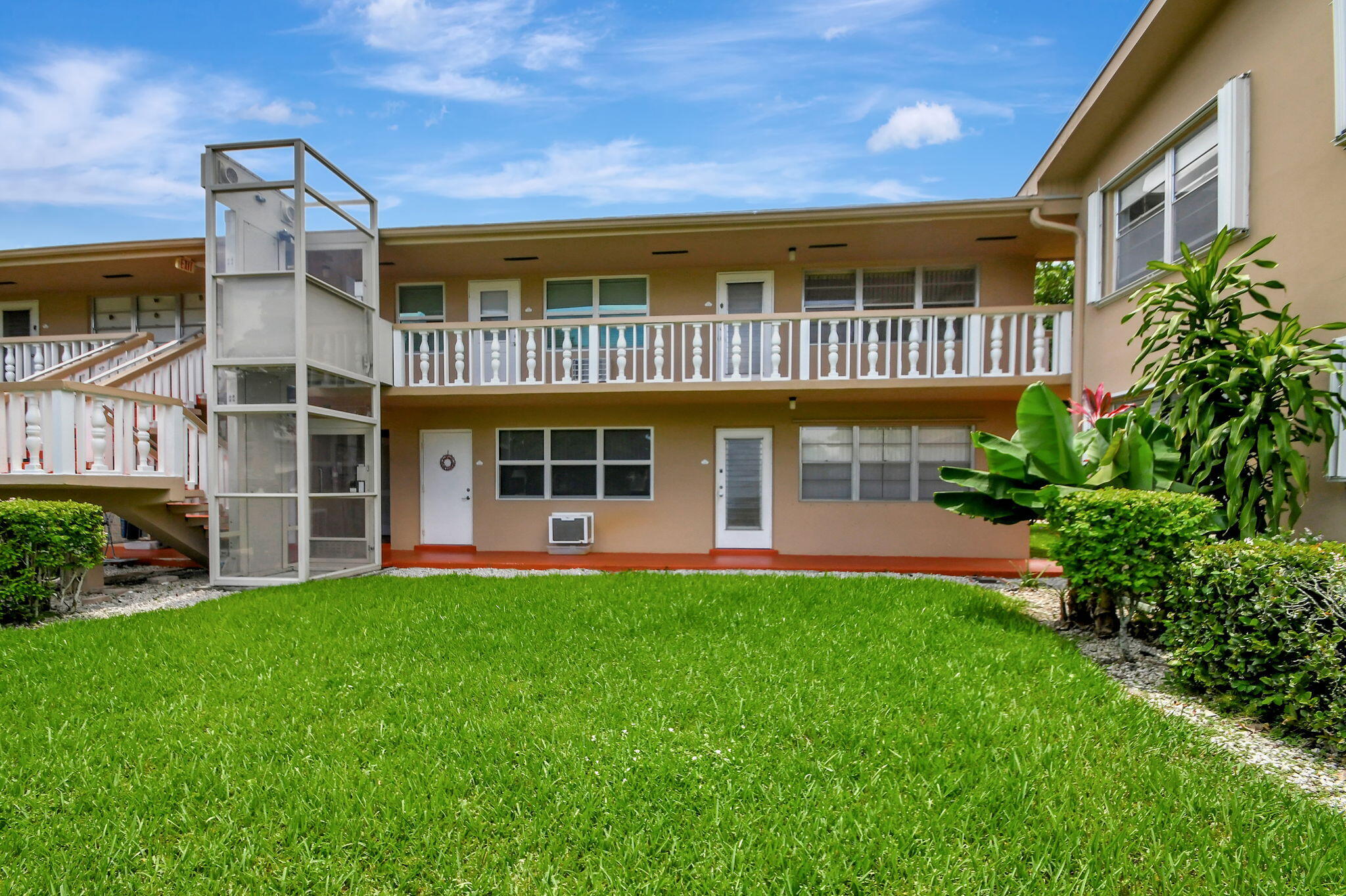 a front view of a house with a yard and porch