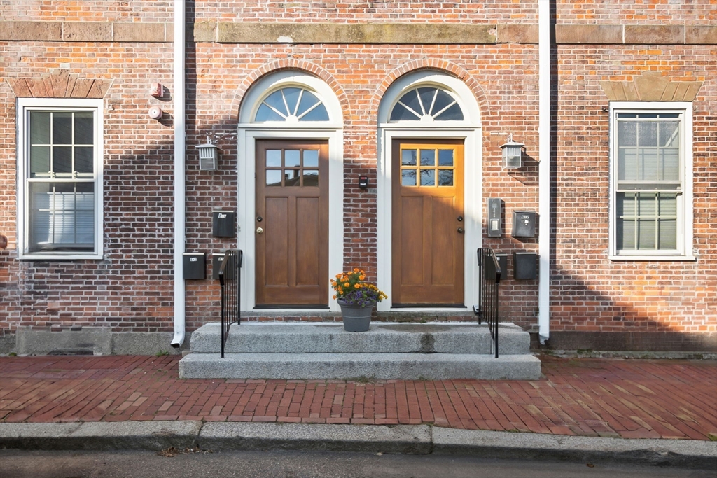 a front view of a house with large windows