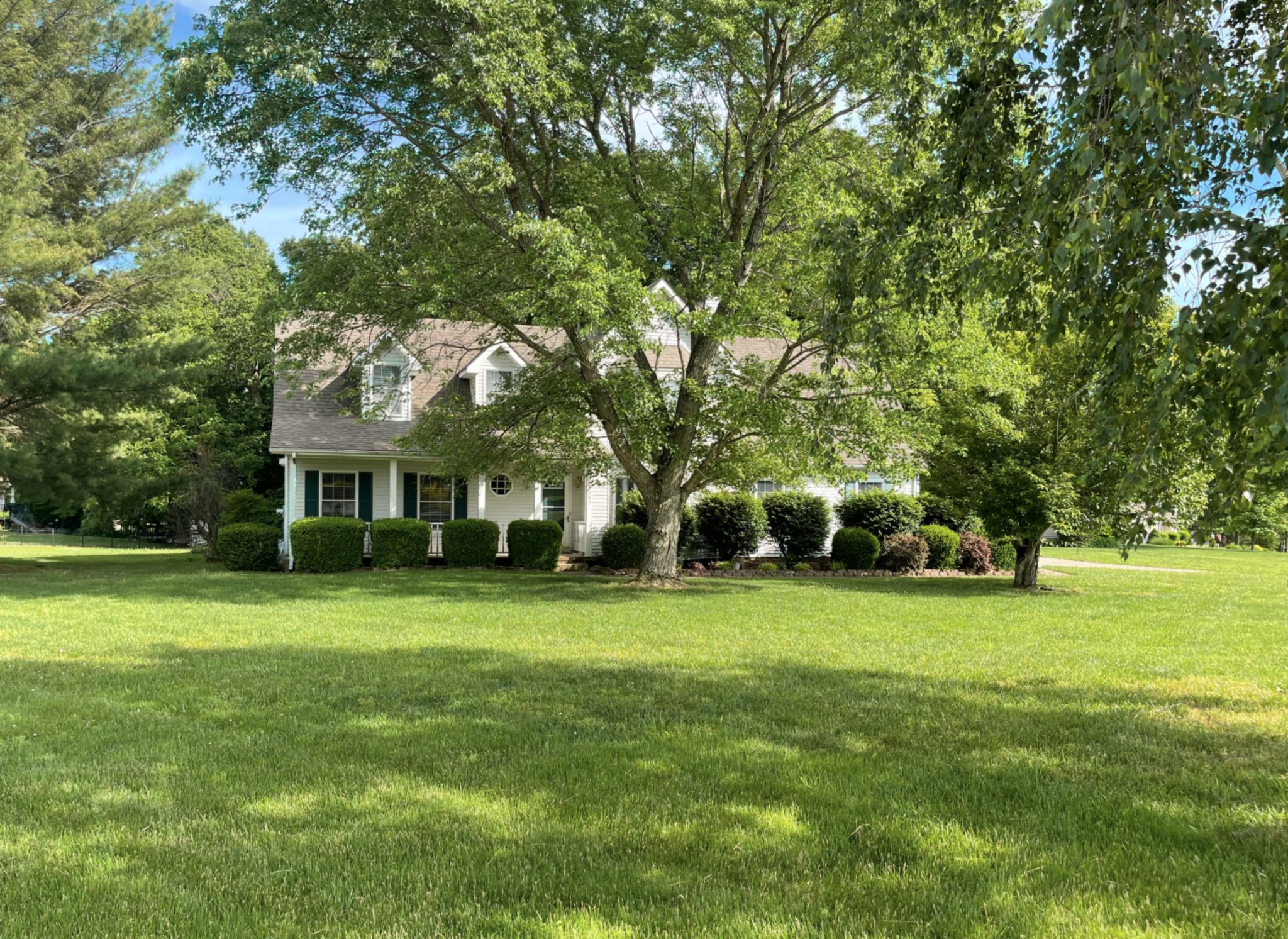 a view of a house with a big yard