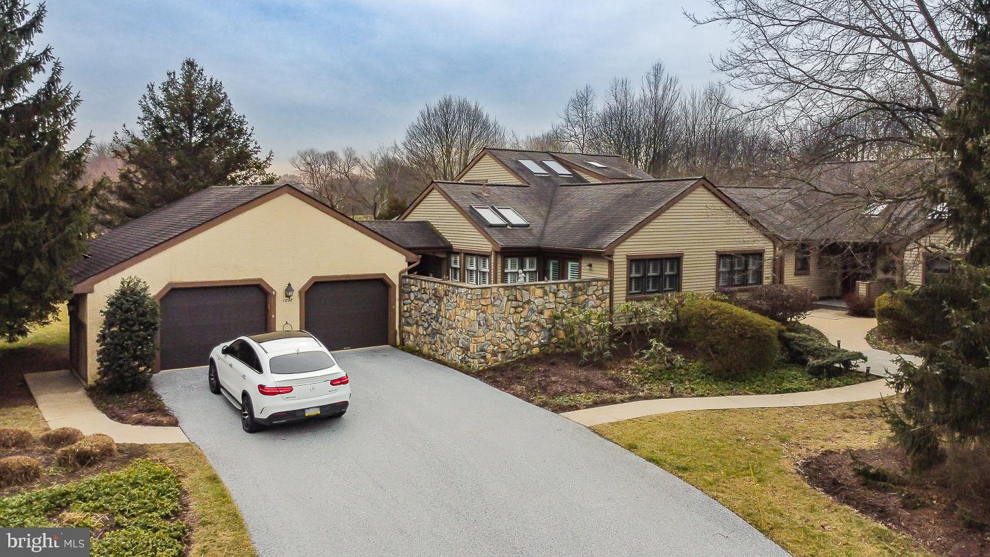 a view of a car park in front of house