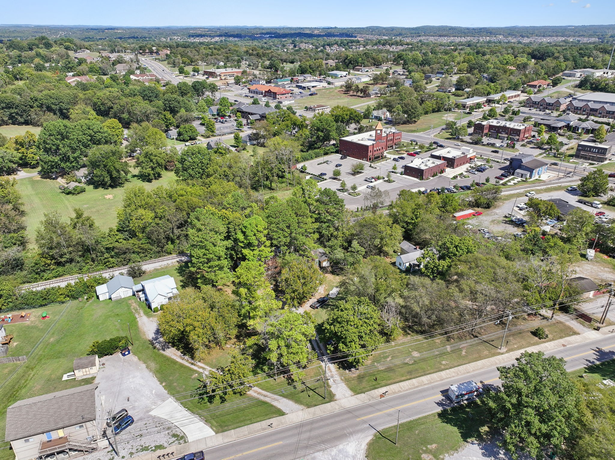 an aerial view of a houses with a yard