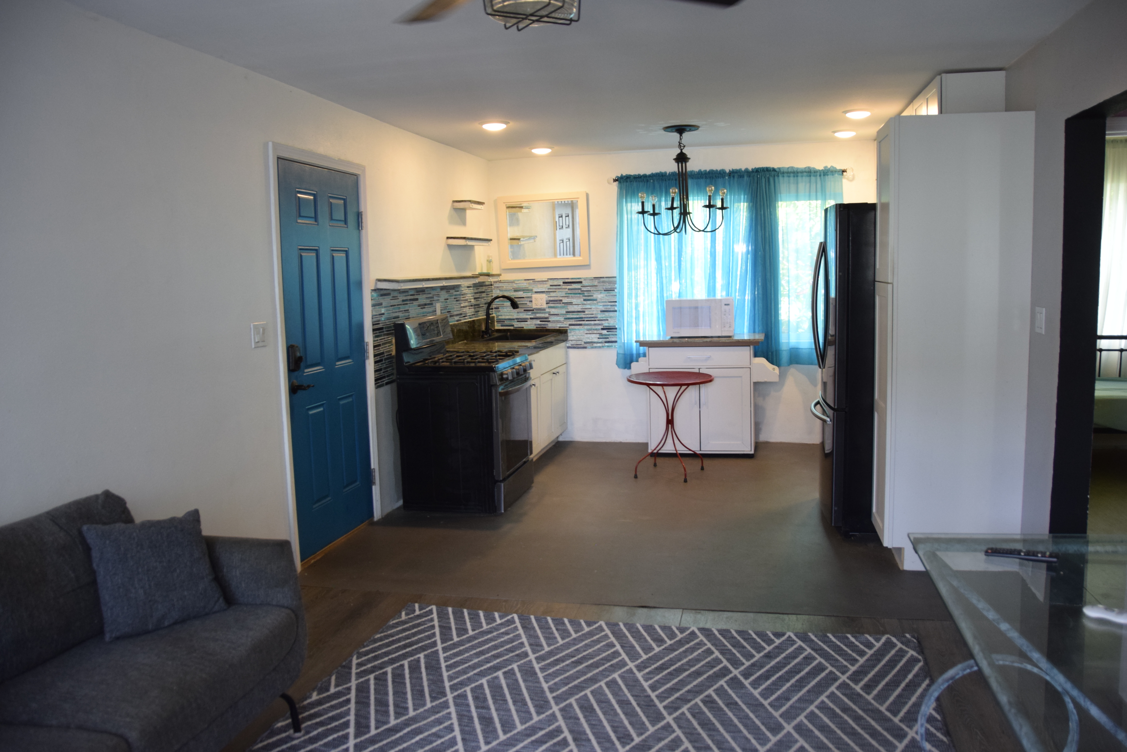 a kitchen with a refrigerator and a sink