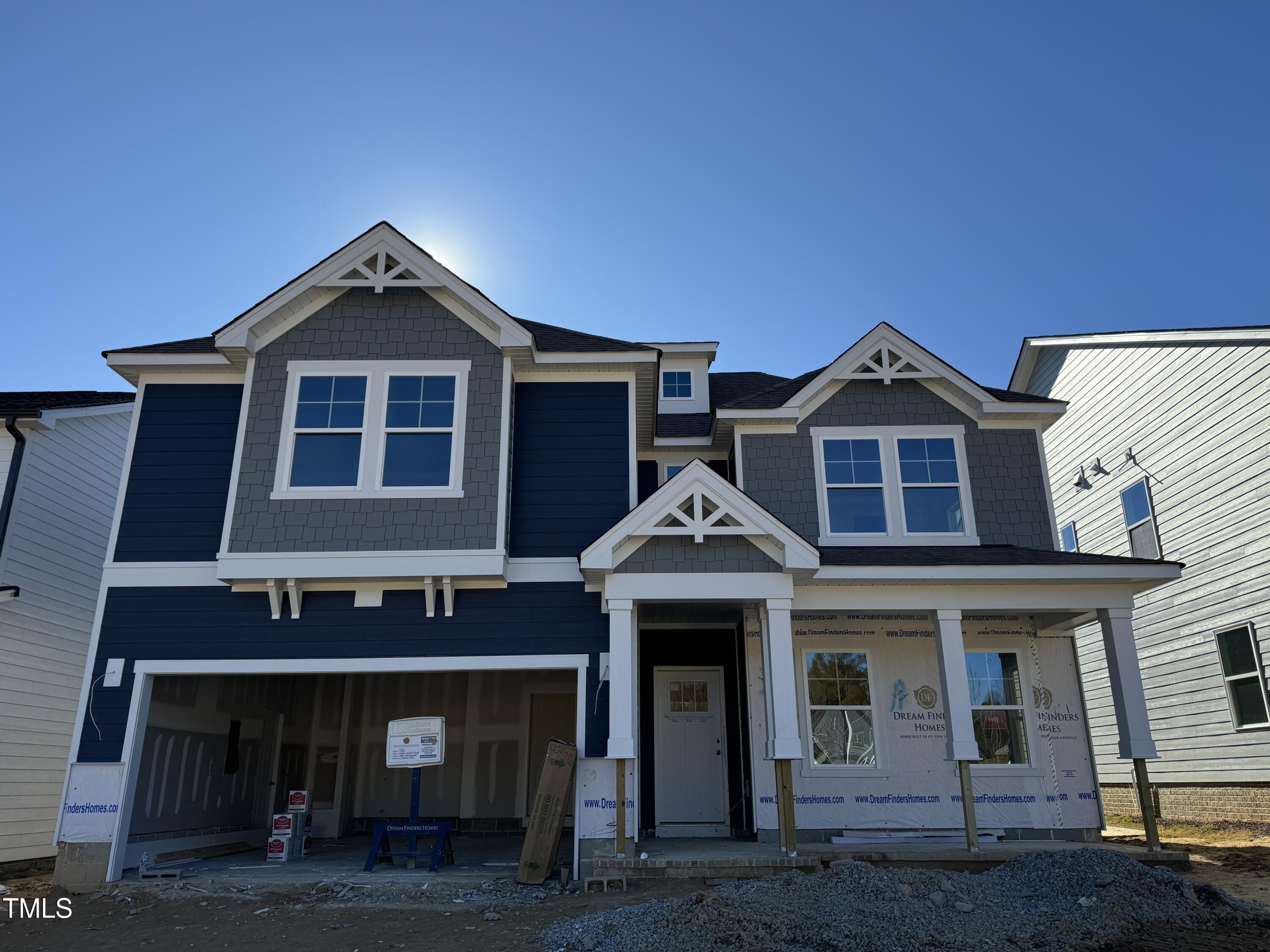 a front view of a house with yard