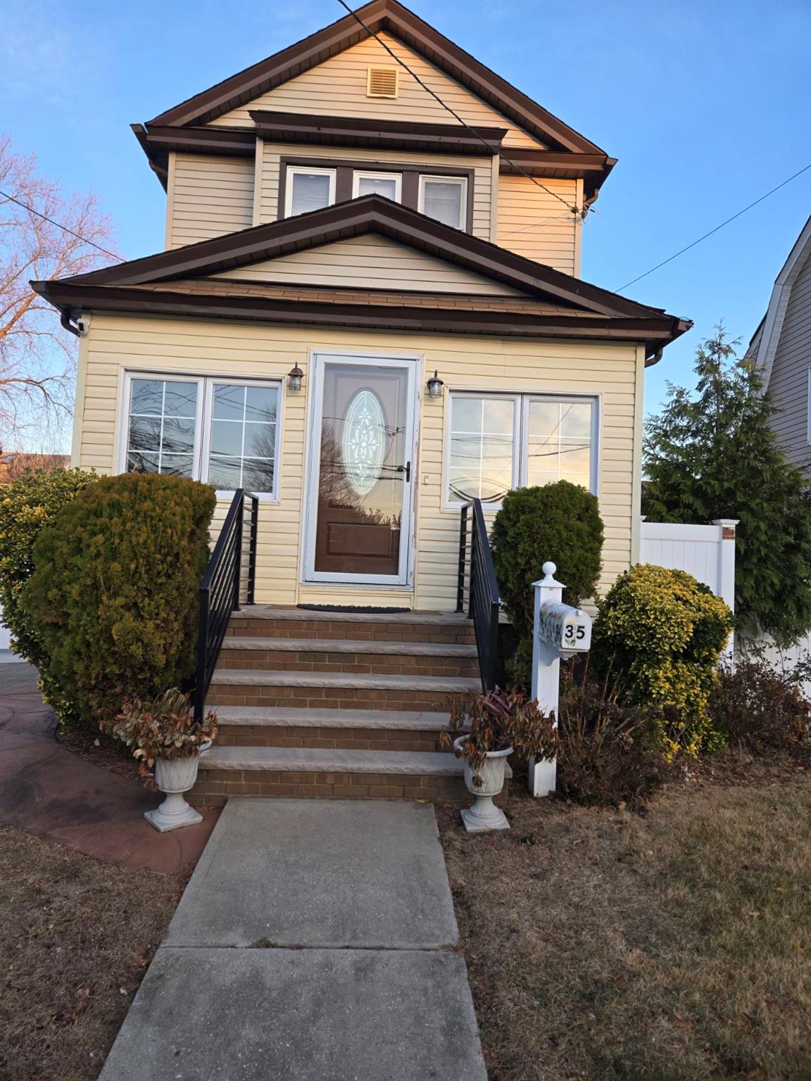 a front view of a house with garden