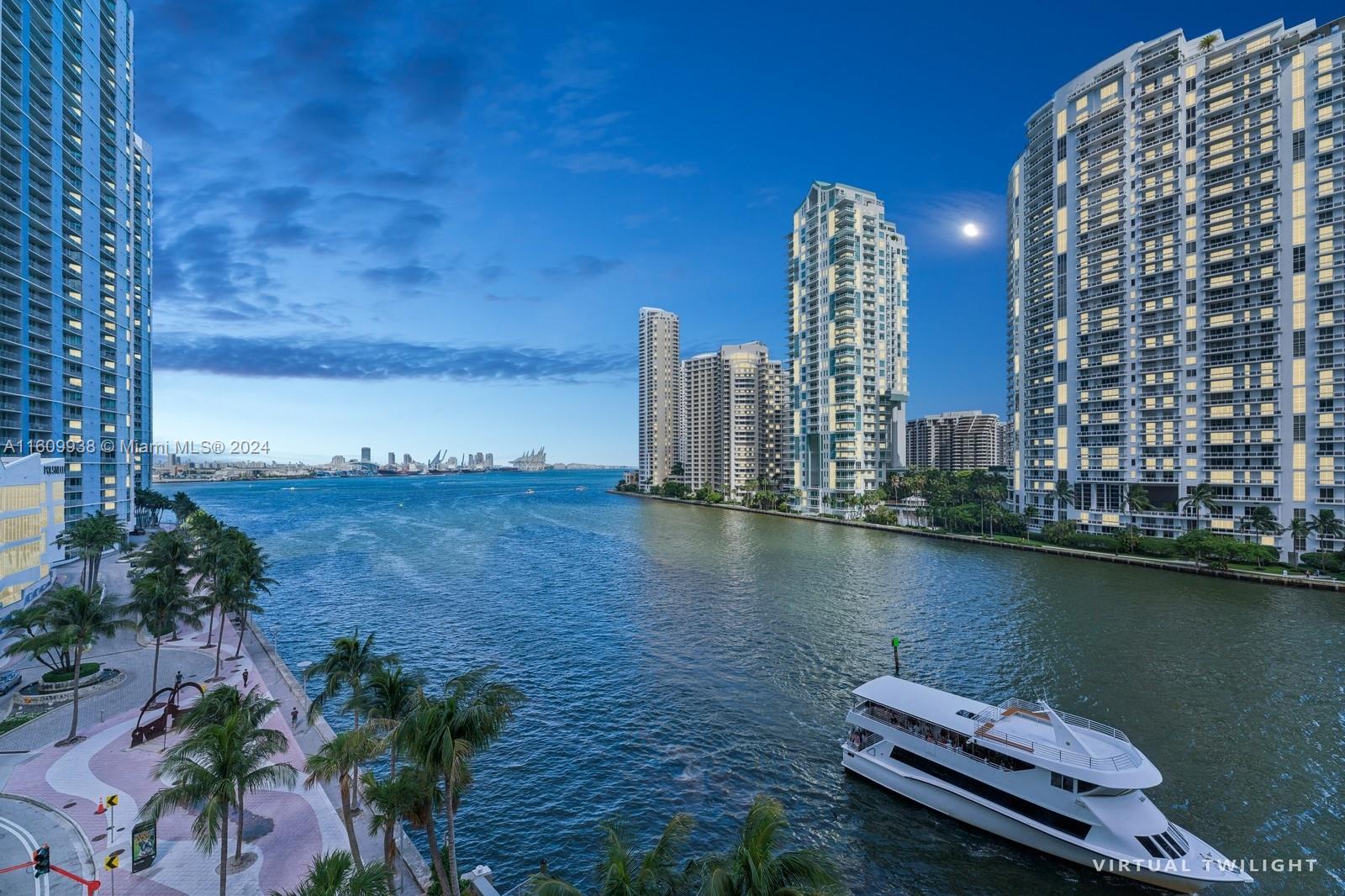 a view of a lake with tall buildings