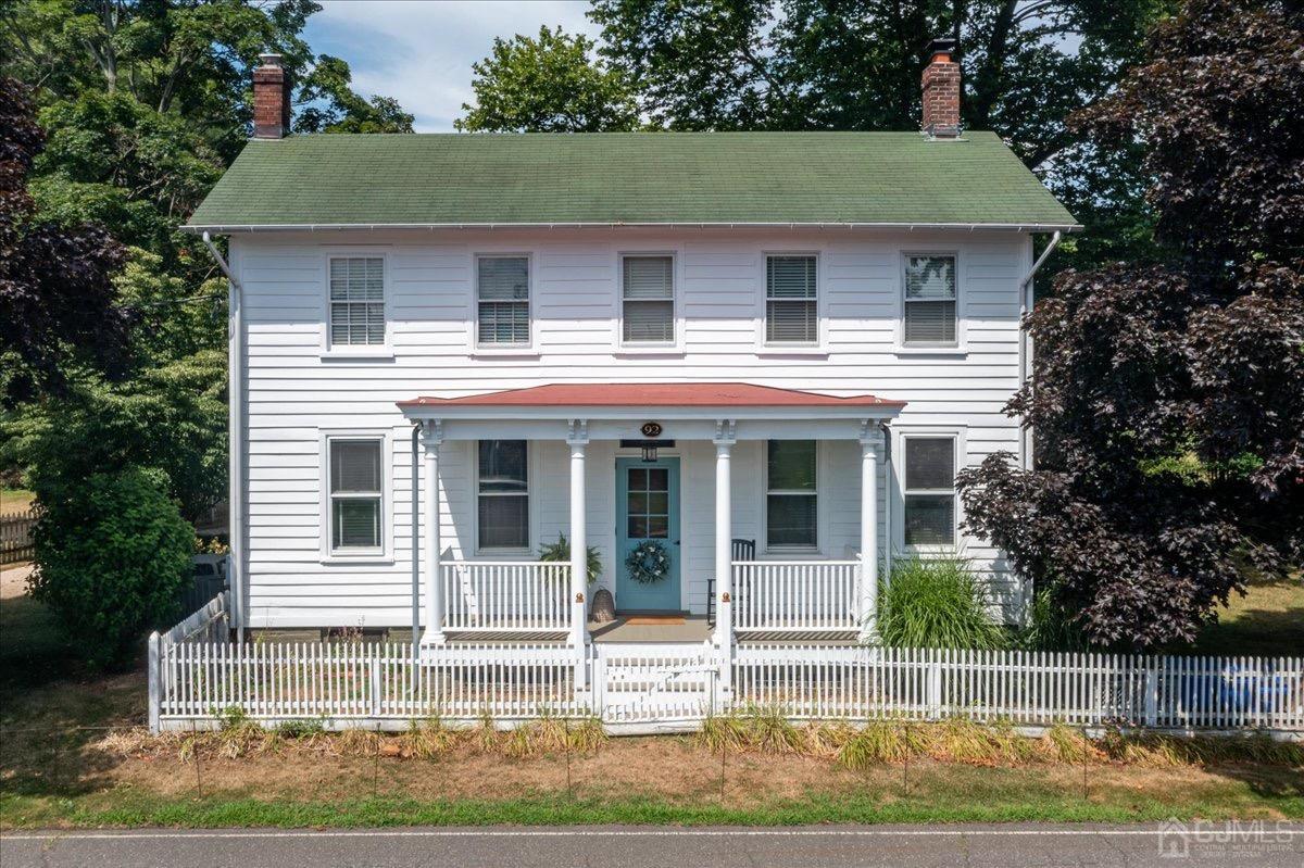 a view of a house with a yard and plants