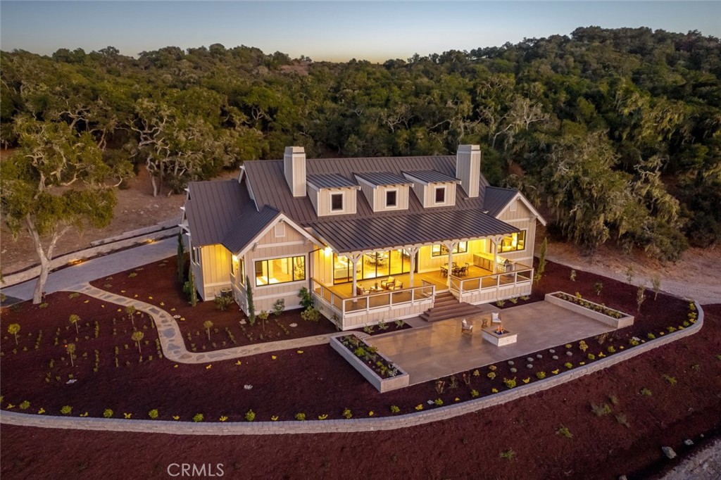 an aerial view of a house with a swimming pool