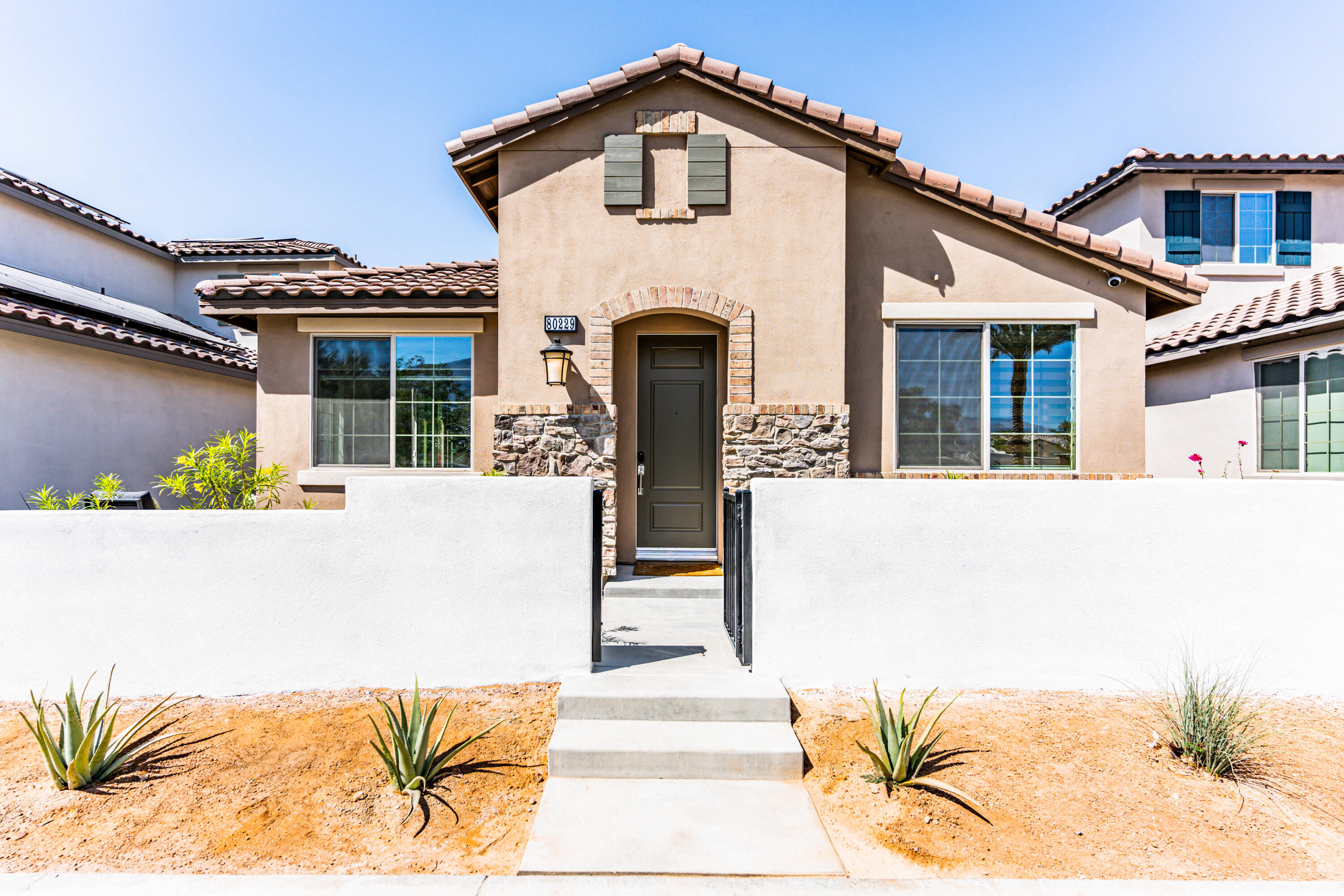 a front view of a house with a outdoor space