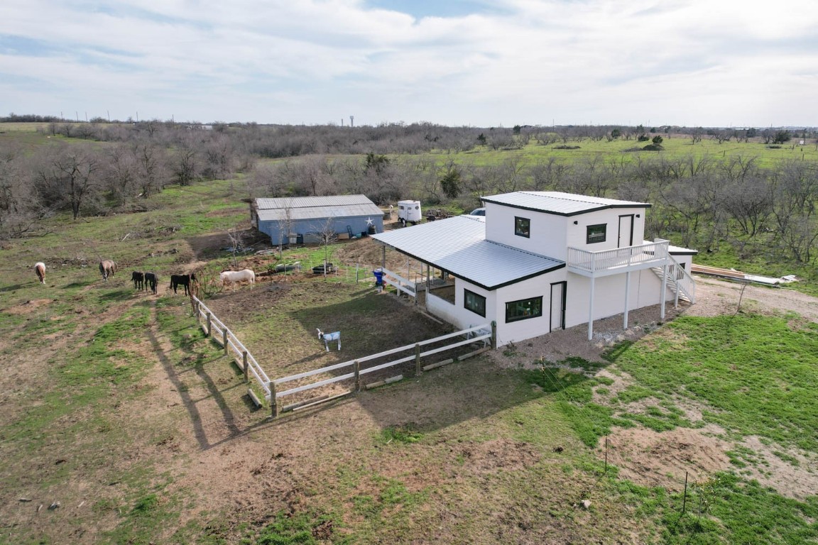 an aerial view of a house with a garden