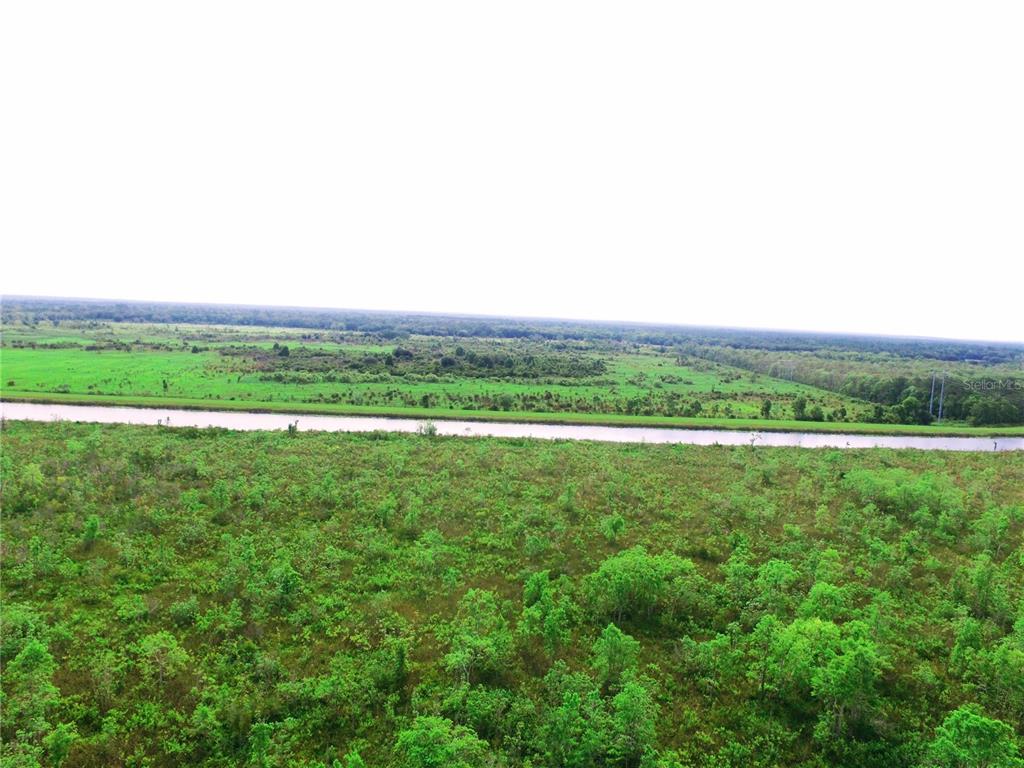 a view of a green field with lots of green space