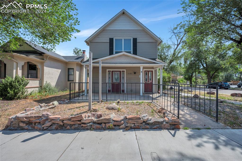 a front view of a house with a porch