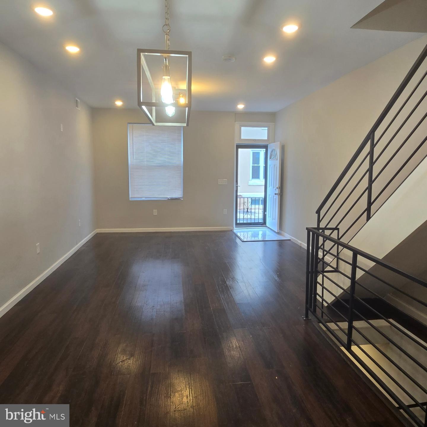 a view of an entryway with wooden floor