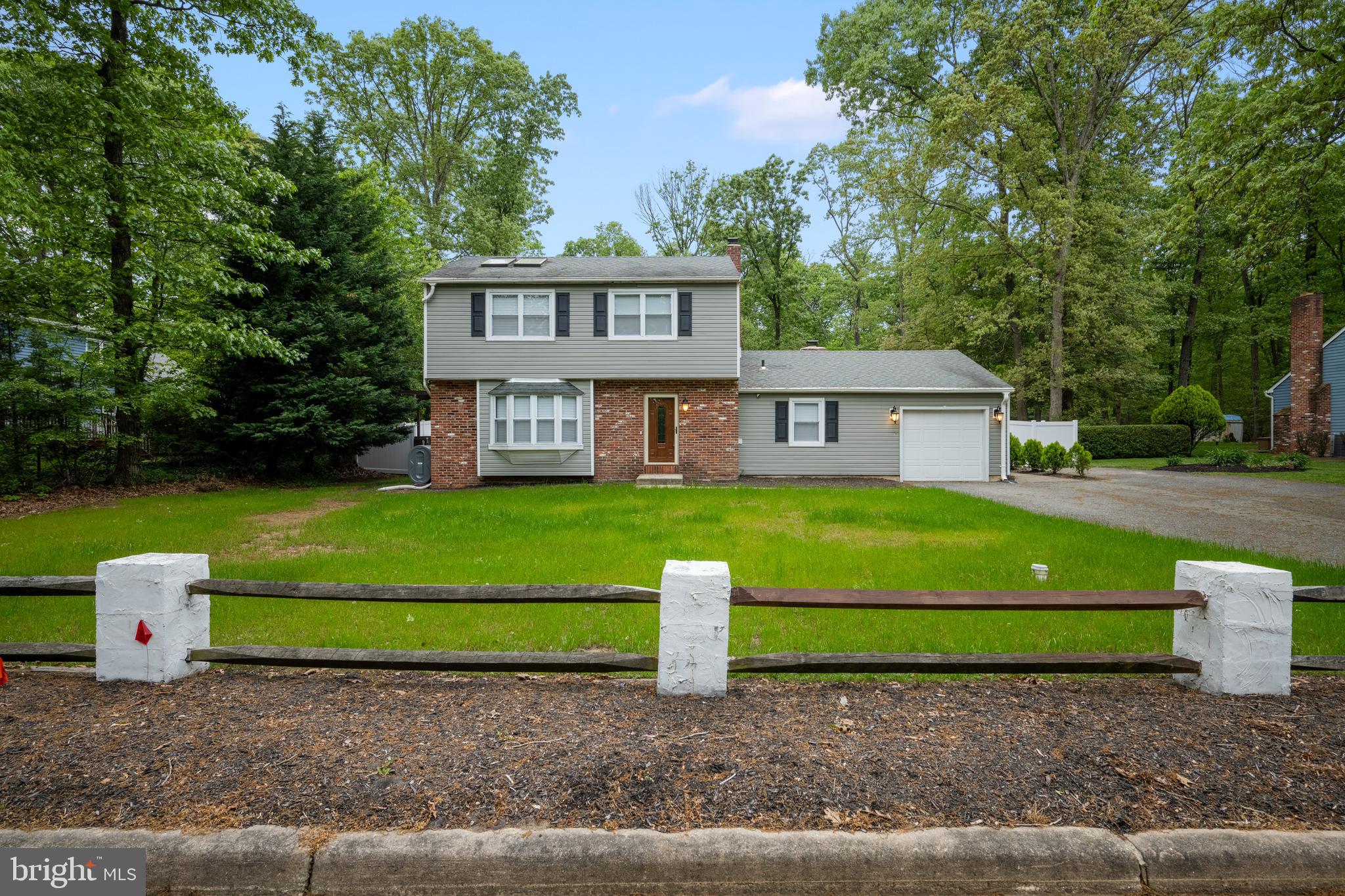 a house view with a seating space and garden