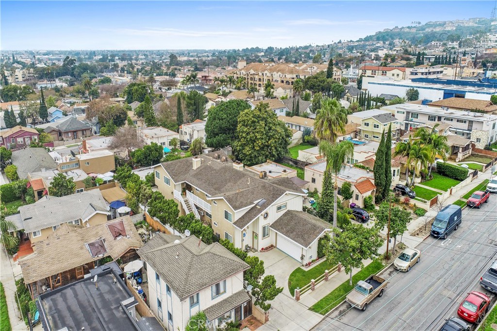 an aerial view of residential houses with outdoor space