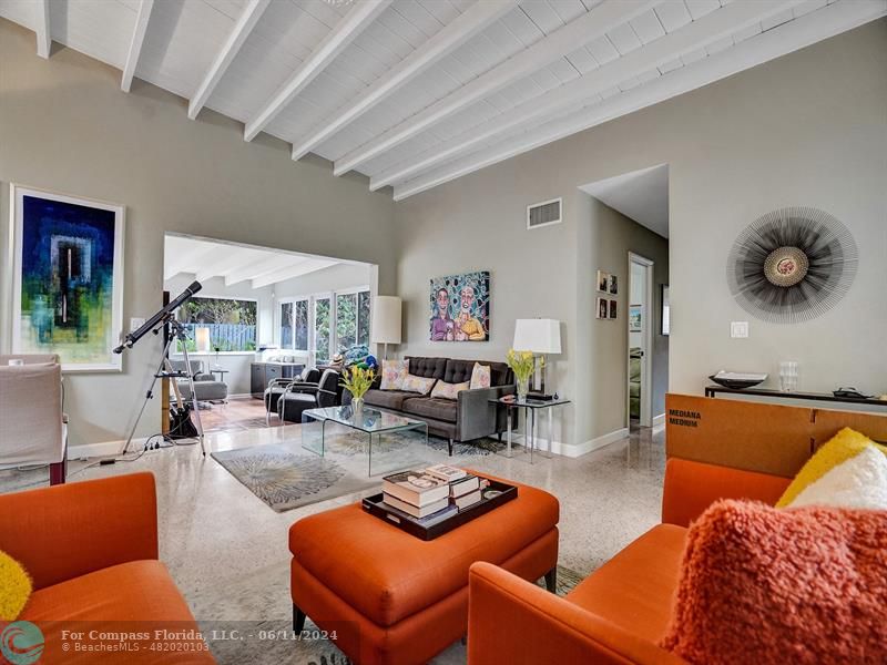 a living room with furniture and a rug