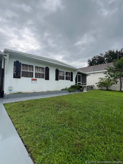 a front view of house with yard