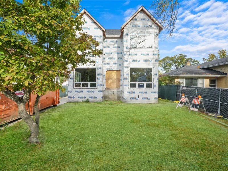 a front view of house with yard and seating area