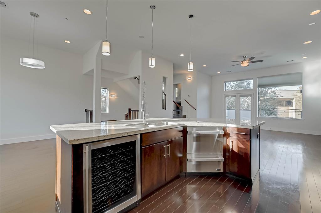 a view of a kitchen counter space and wooden floor