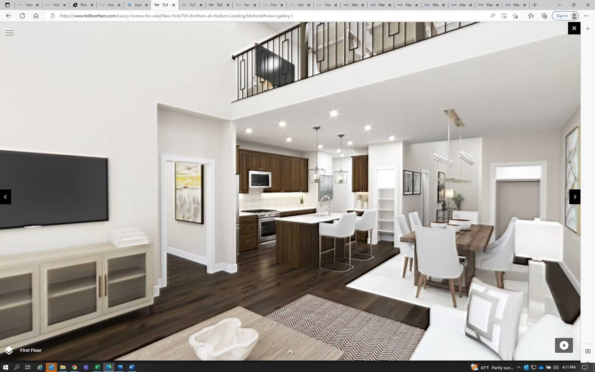 a living room with furniture a flat screen tv and kitchen view