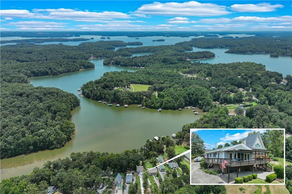 an aerial view of residential building and lake