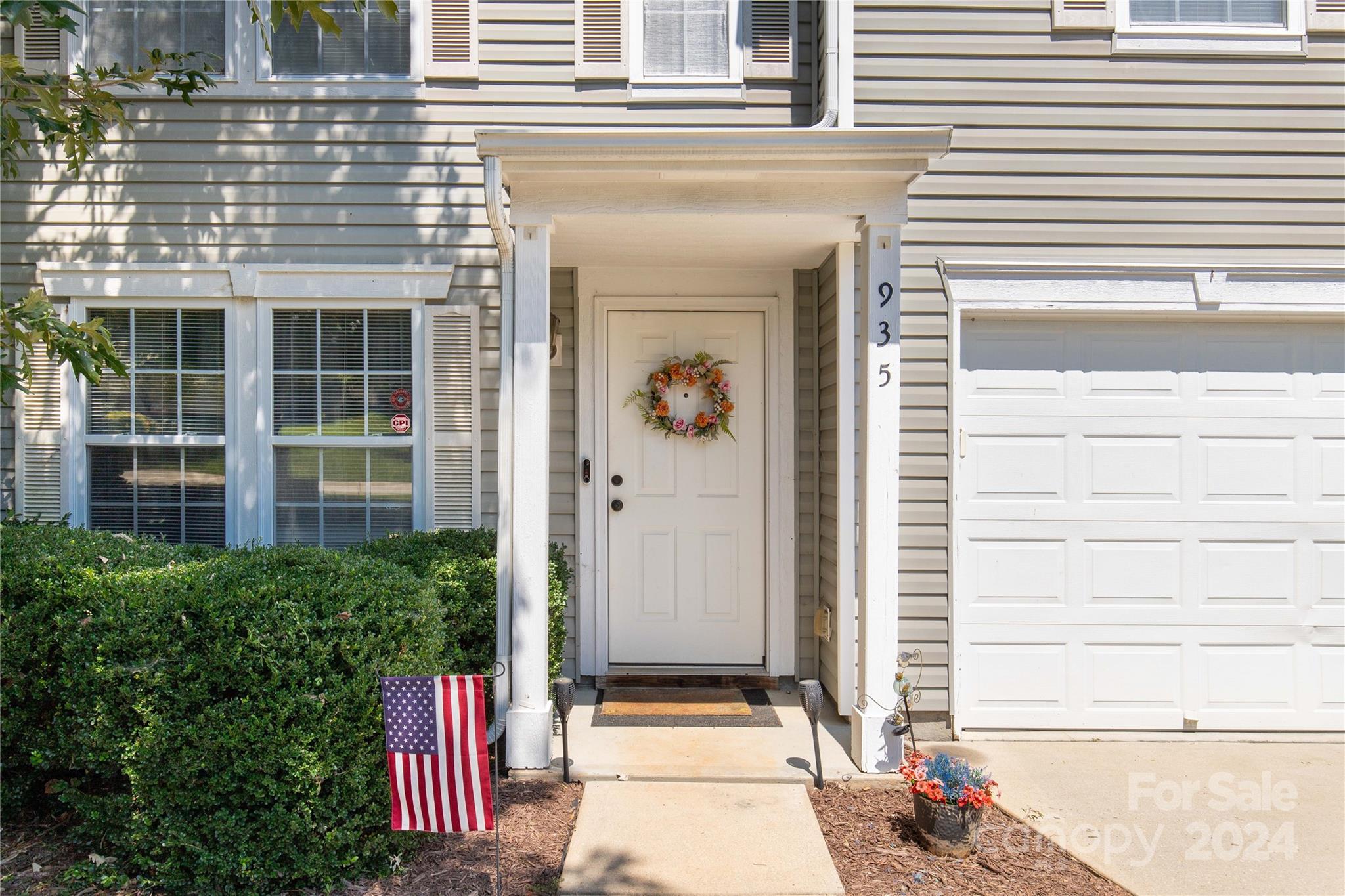 a front view of a house with a garage