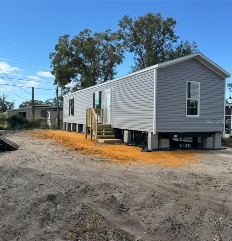 a backyard of a house with shaded area