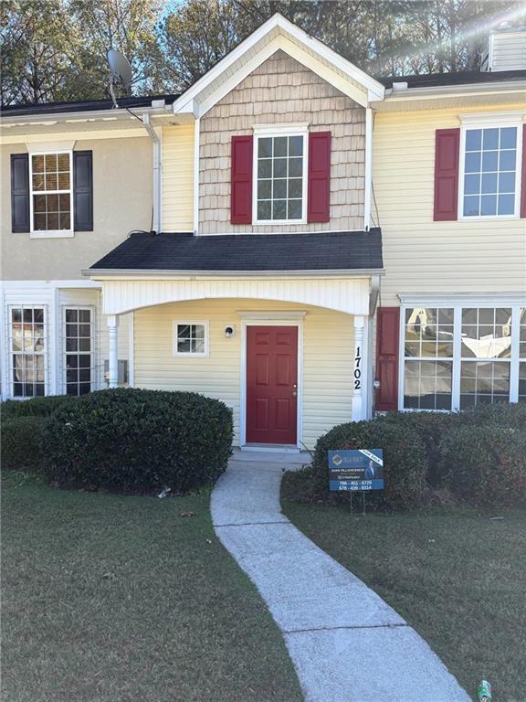 a front view of a house with a yard