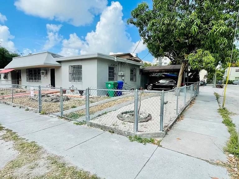 a front view of a house with yard