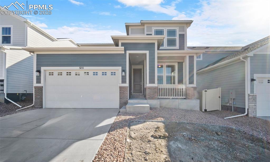 a front view of a house with parking space