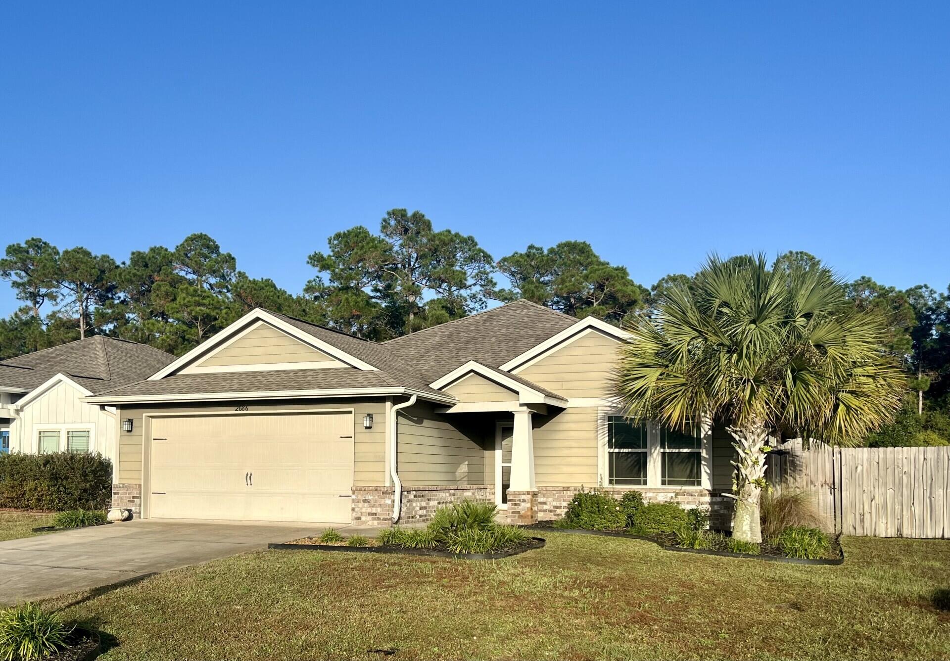 front view of a house with a yard