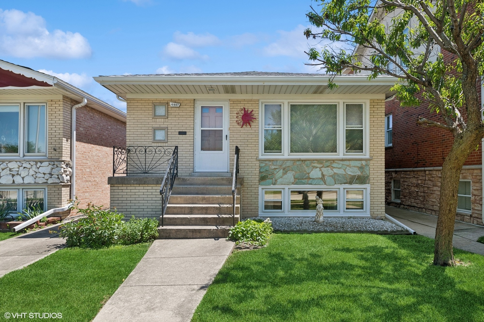 a front view of a house with garden