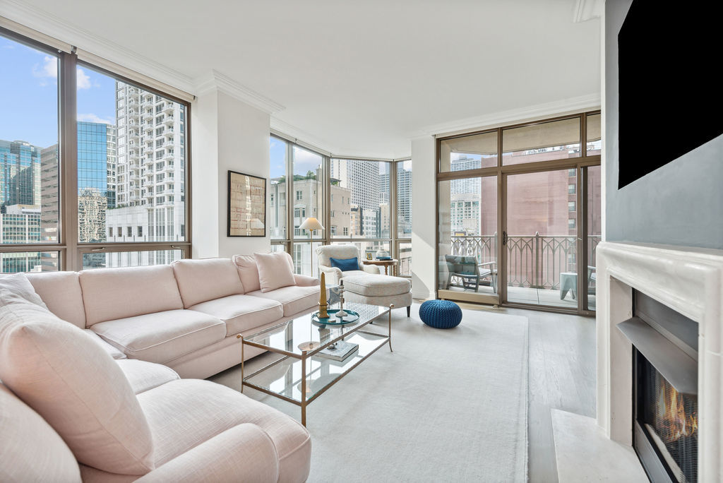 a living room with furniture and a fireplace