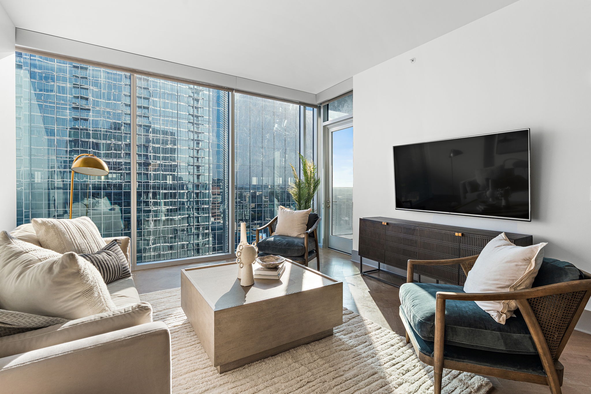 a living room with furniture and a flat screen tv