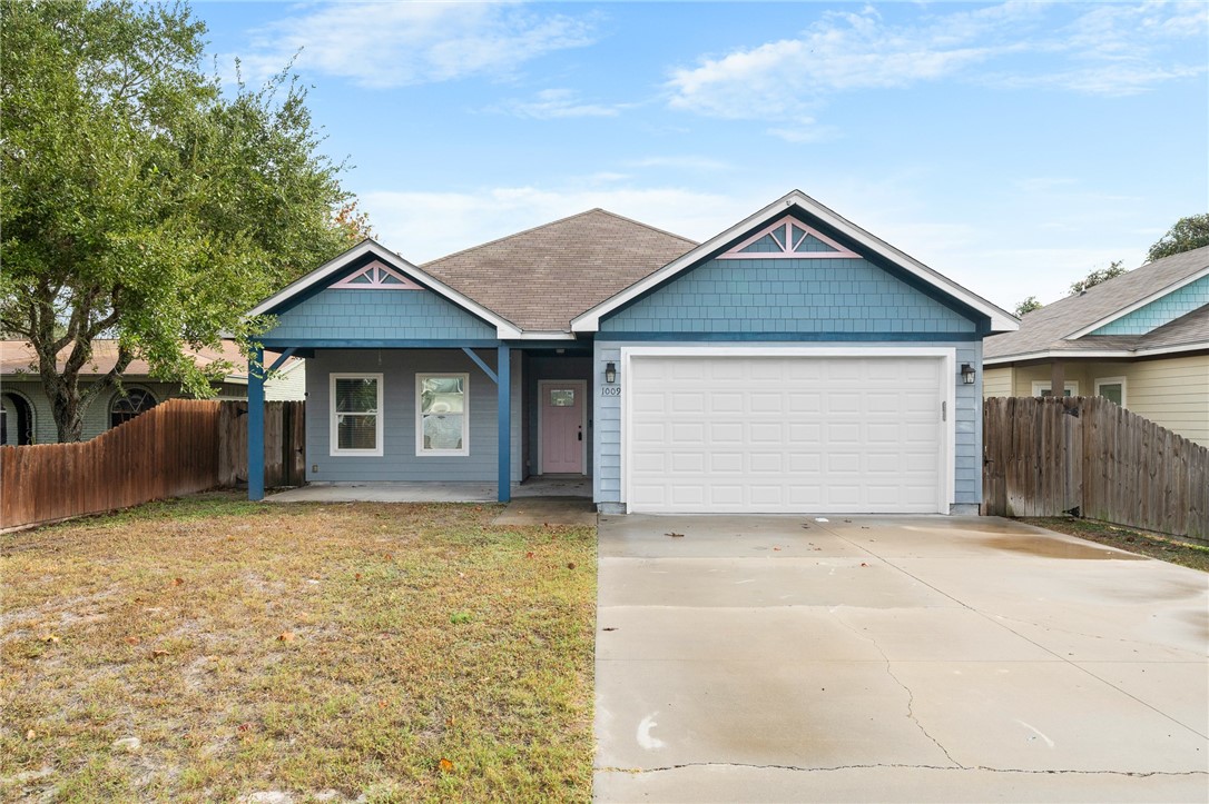 a house with yard in front of it