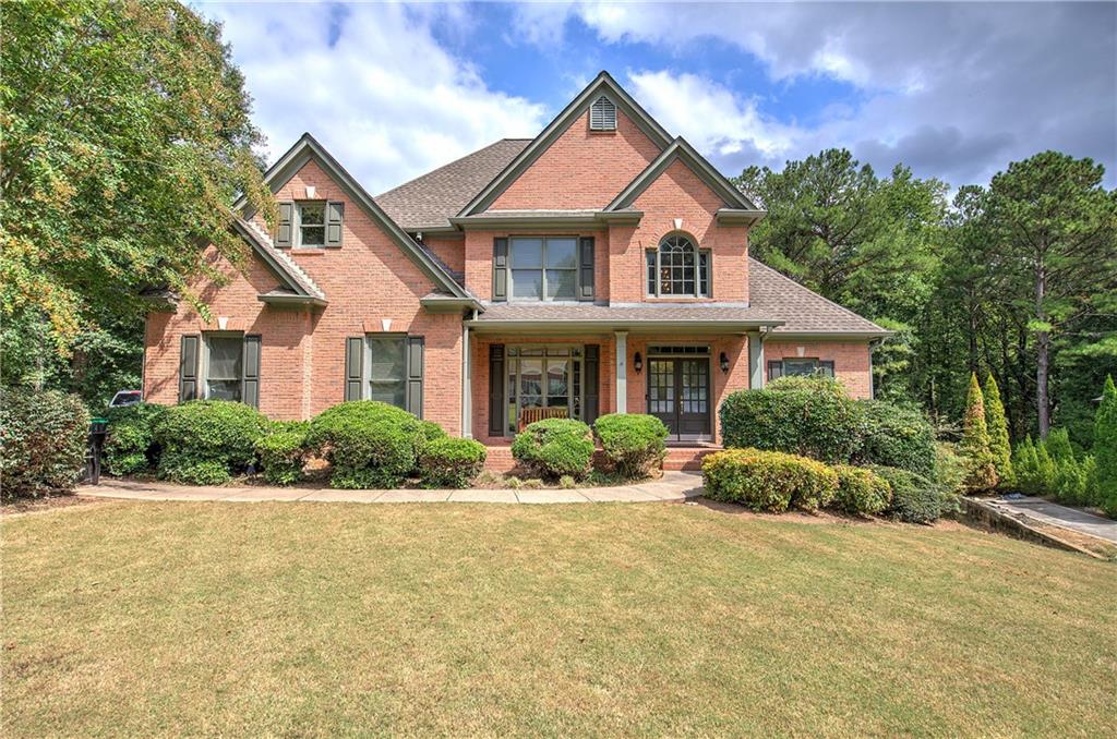 a front view of a house with a yard