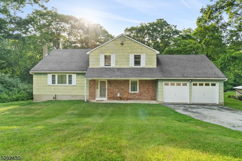 a view of a yard in front of a house with a yard