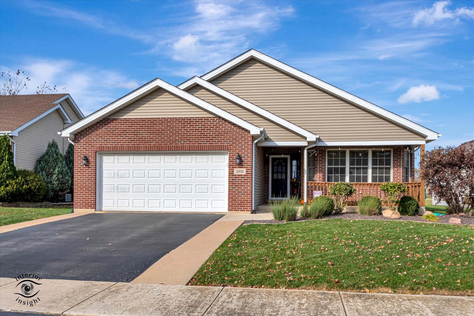 front view of a house with a yard