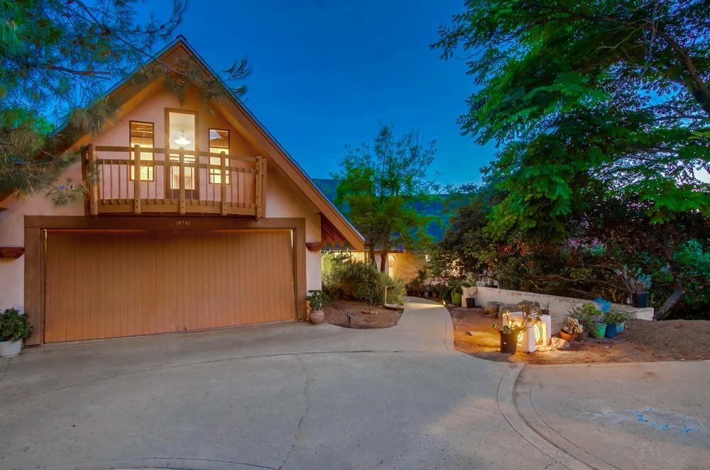 a backyard of a house with yard and garage