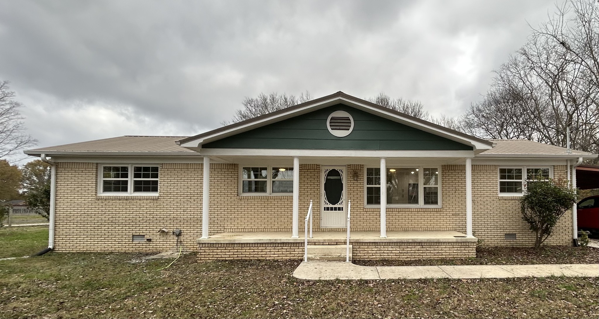 a front view of a house with a yard