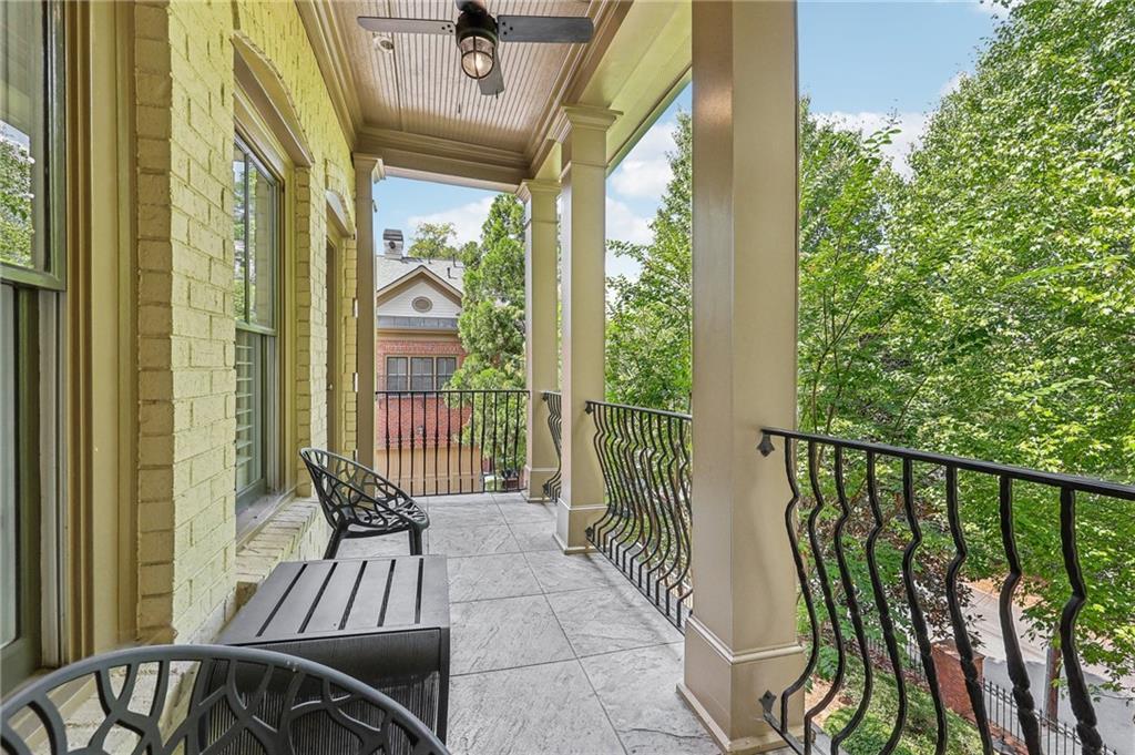 a view of balcony with furniture