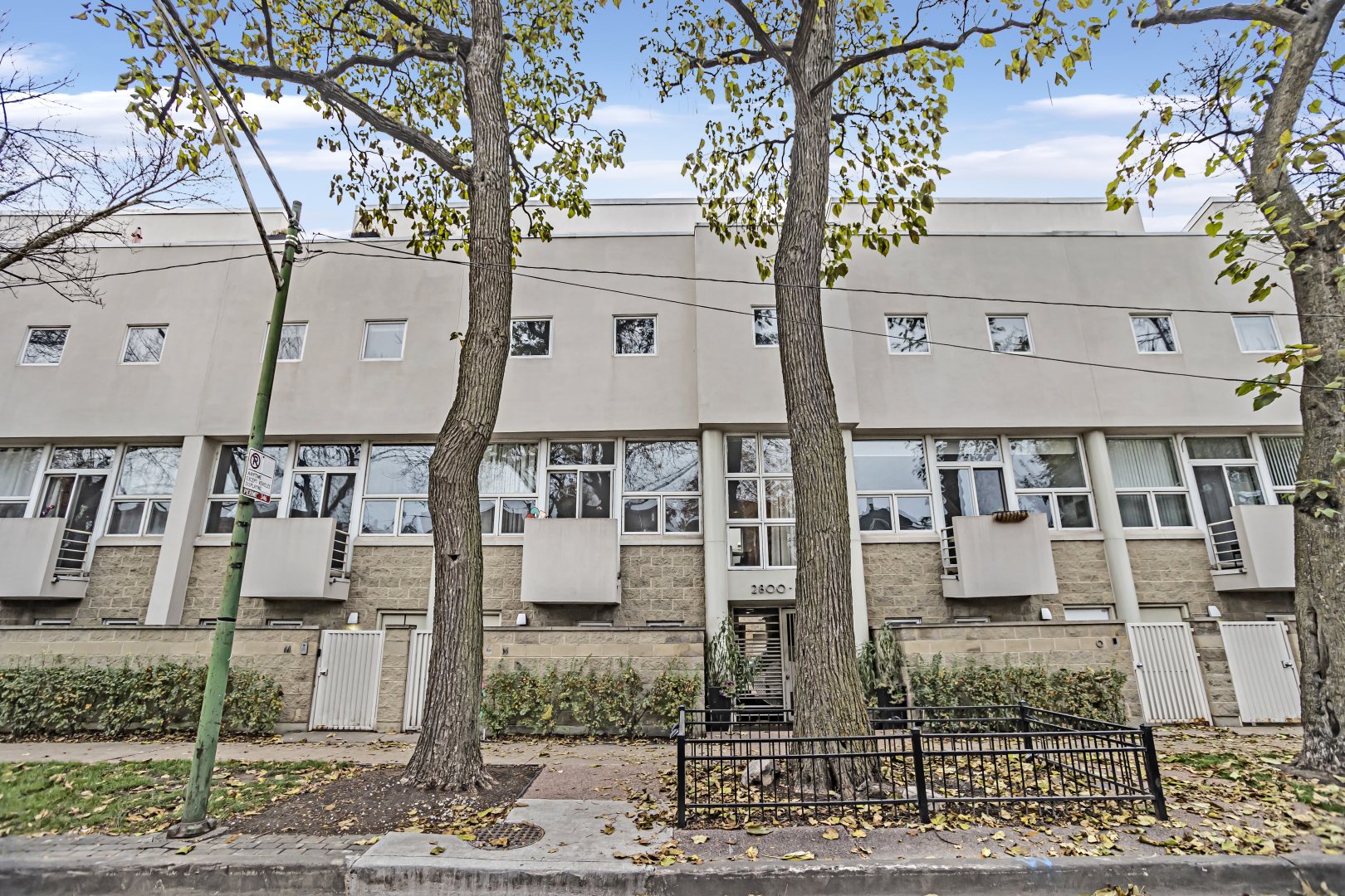 a front view of a building with street view