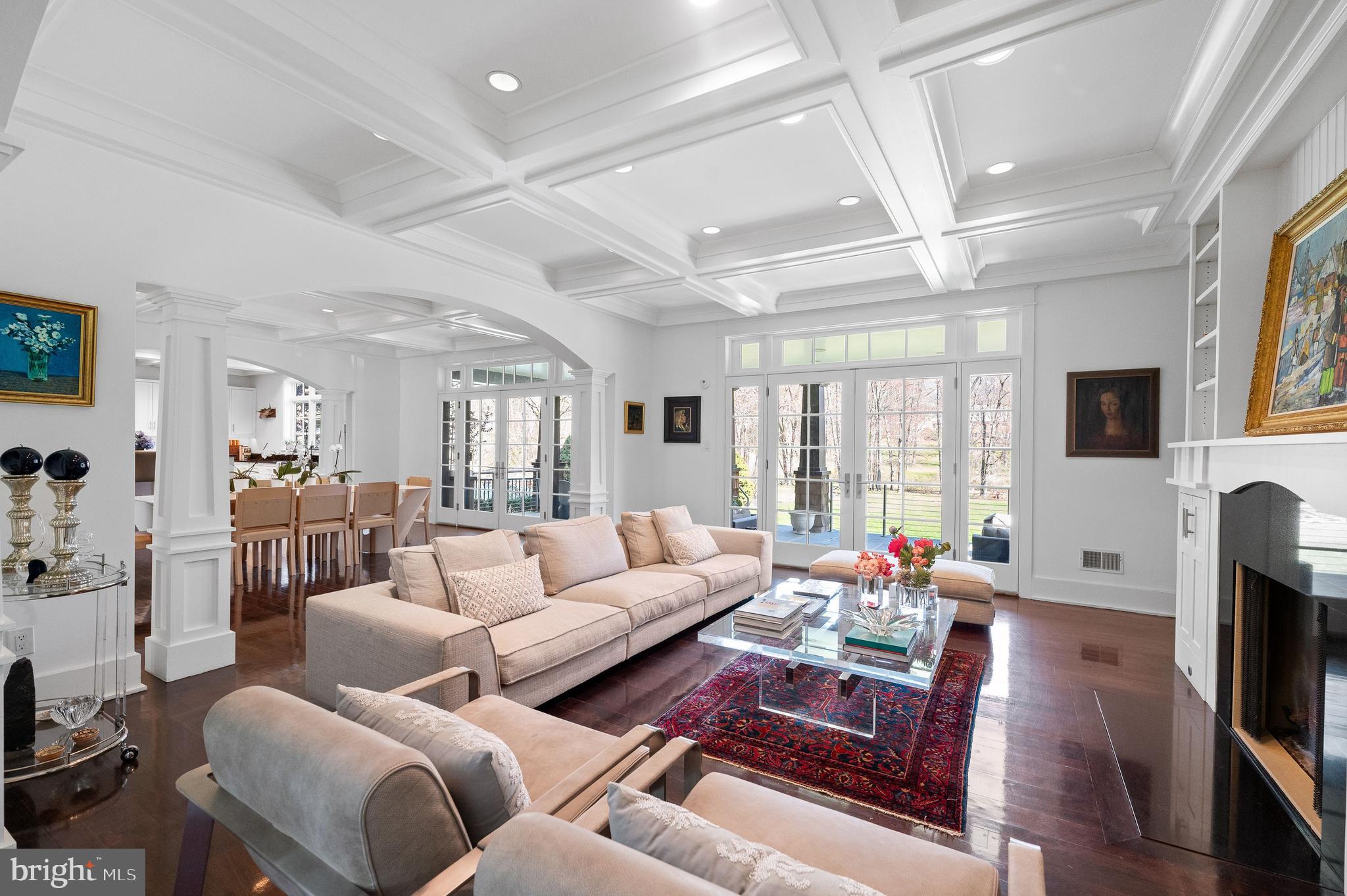 a living room with furniture wooden floor and a flat screen tv