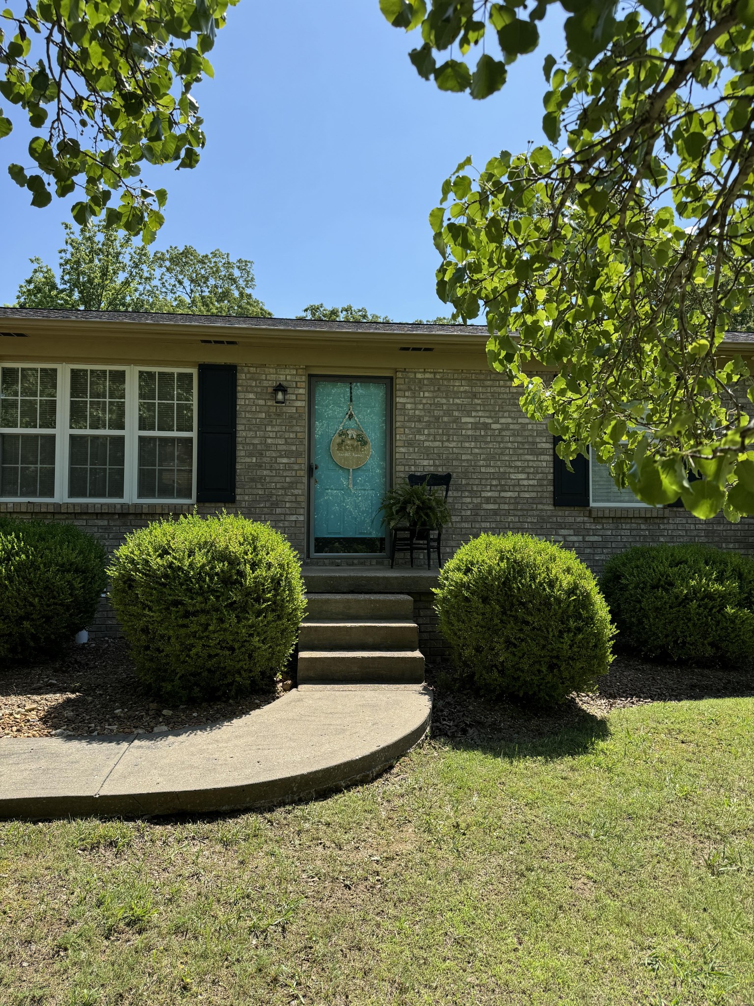 a front view of a house with garden