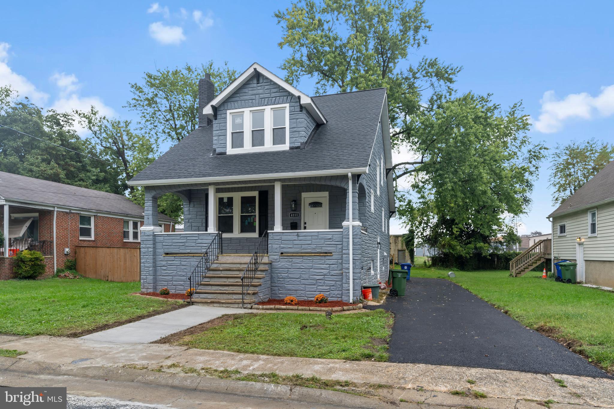 front view of a house with a yard