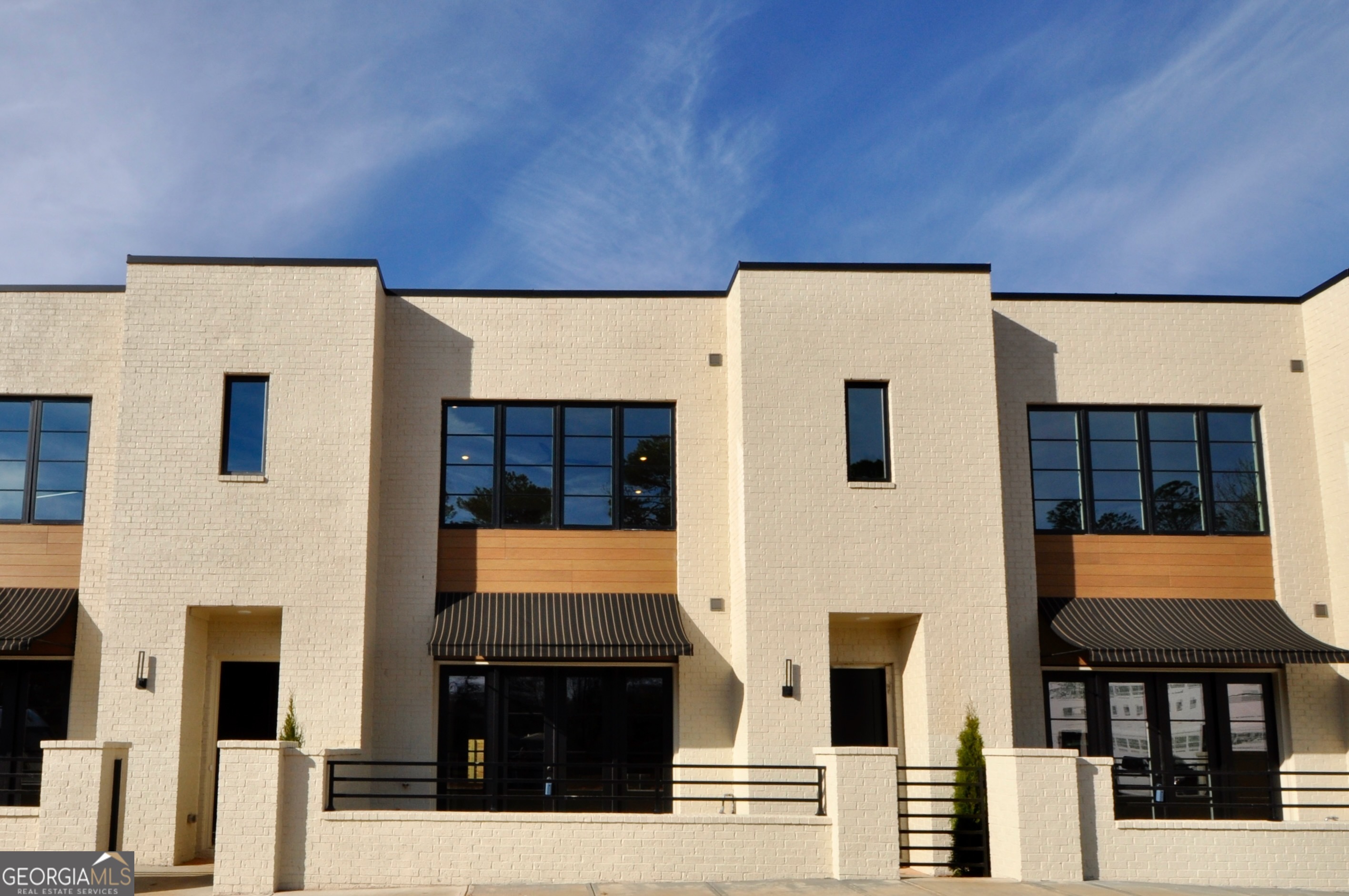 a front view of a building with glass windows