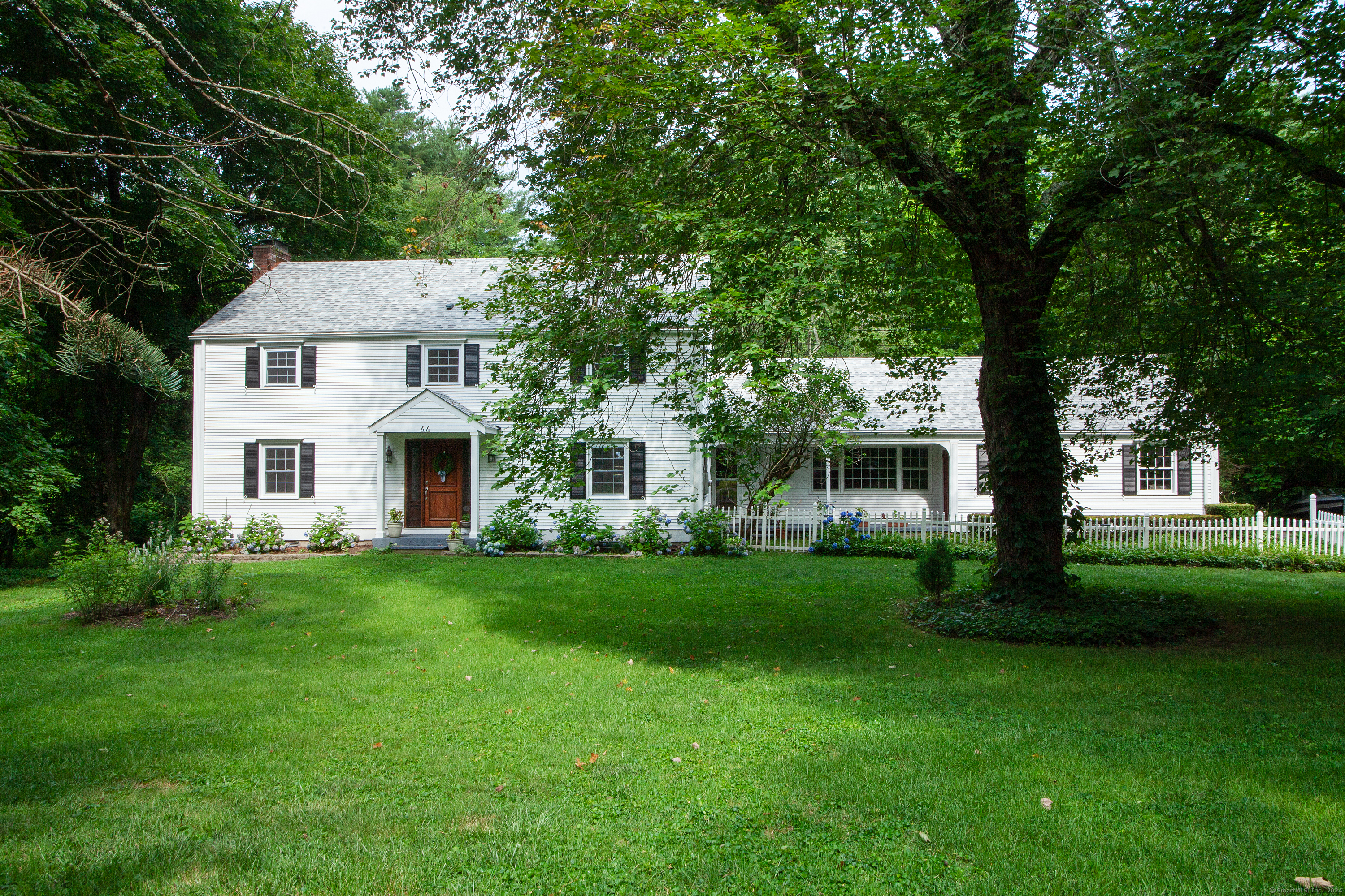 a aerial view of a house with a yard