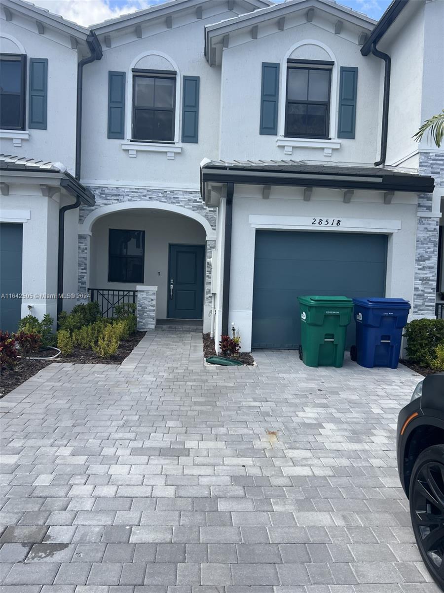 a front view of a house with yard