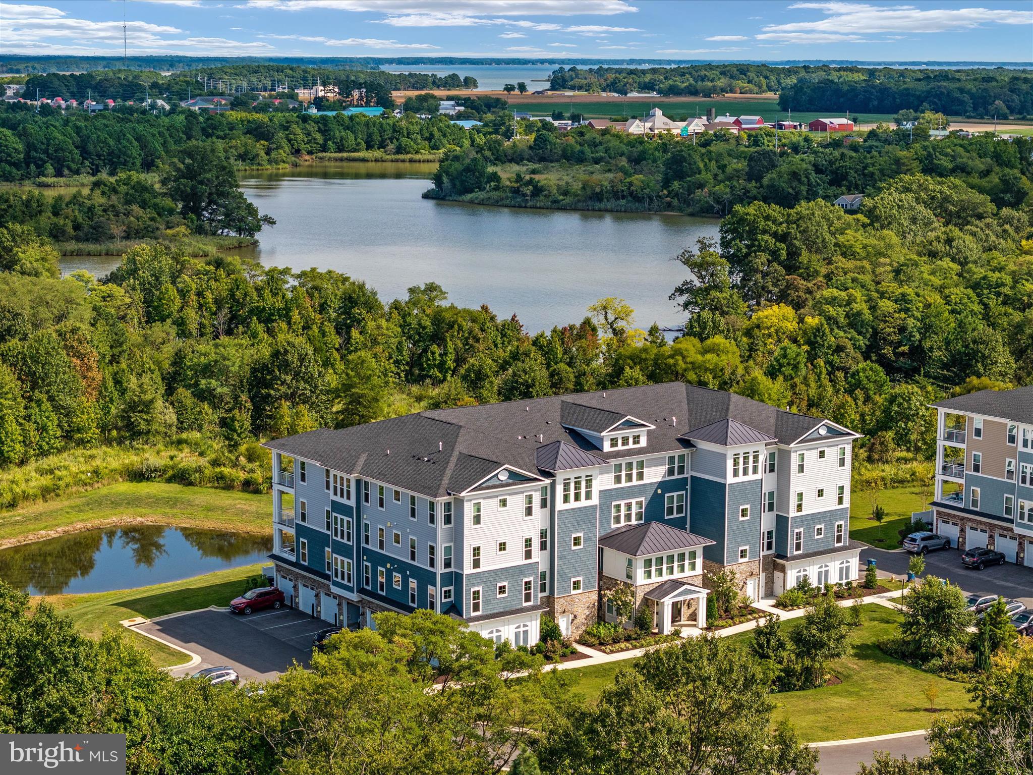 an aerial view of a house with a lake view