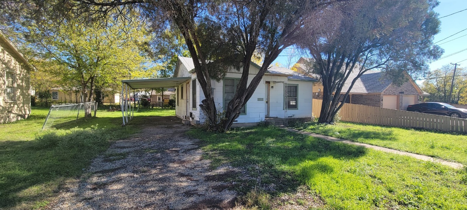 a view of house with yard